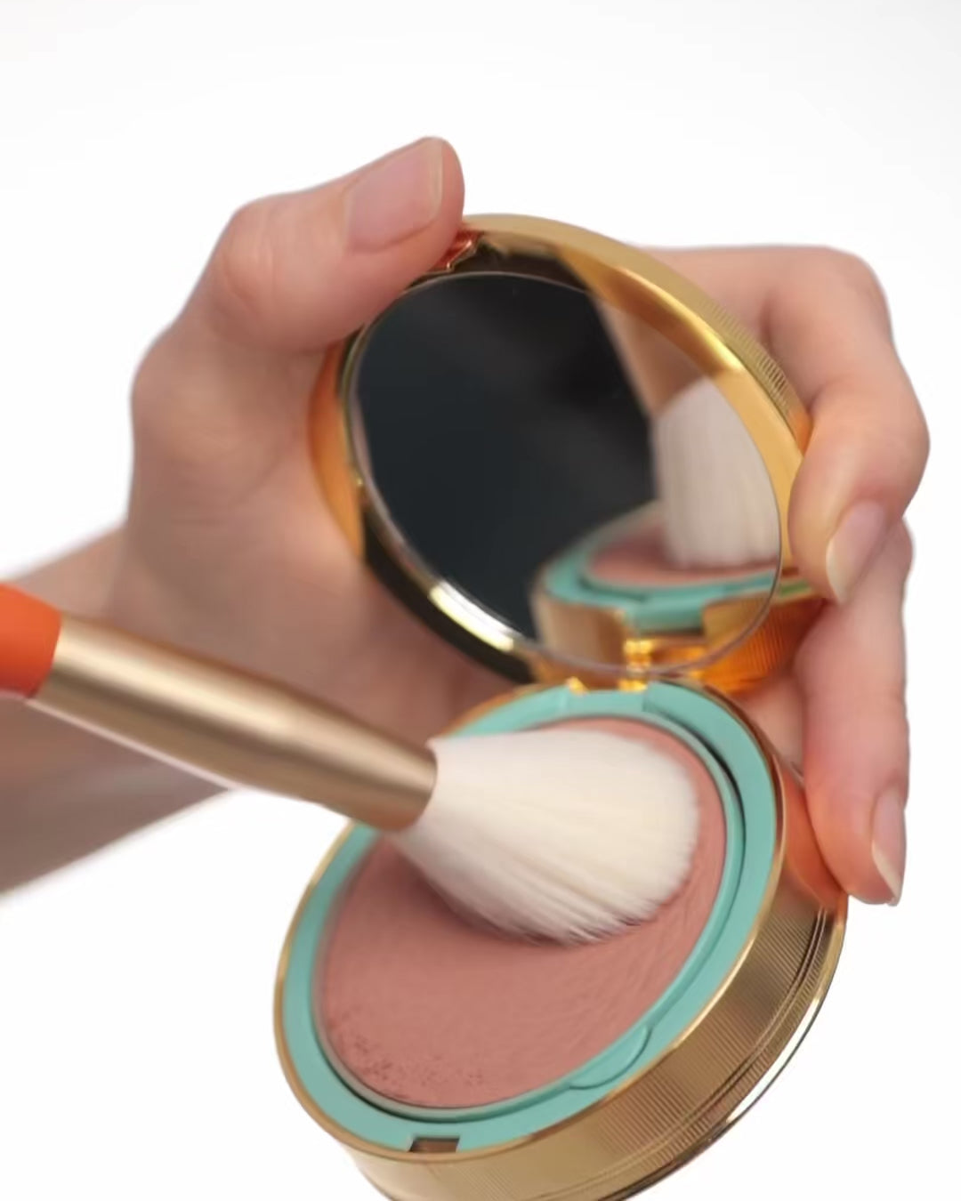 Brush applying blush on the face