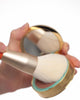 Bronzer brush applying bronzer